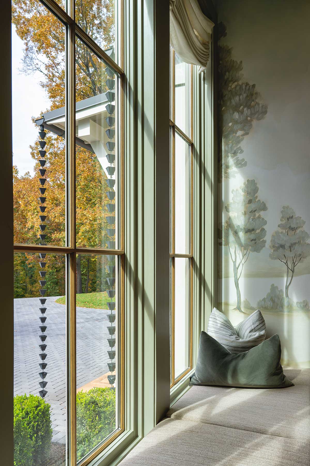 A window seat beneath Marvin Elevate Direct Glaze windows in the 2023 Southern Living Idea House in Nashville, TN.