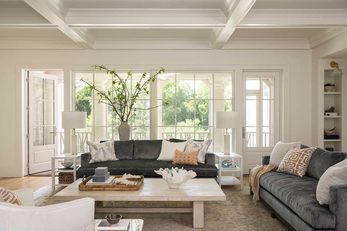 A traditional living room in a Sullivan's Island home featuring Marvin Ultimate Casement Picture windows.
