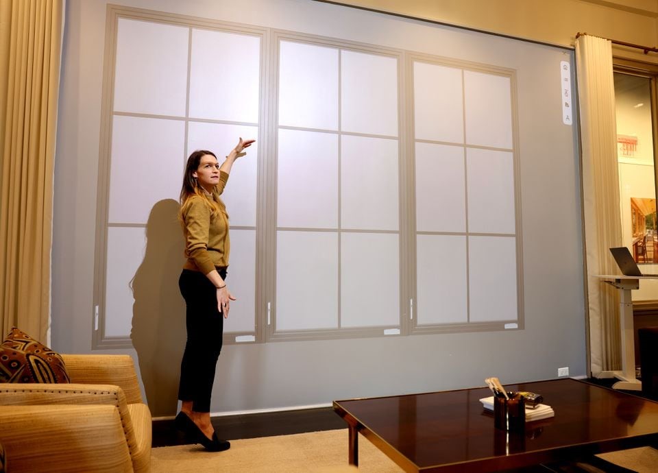 Rachael Bartlett, manager of Marvin at 7 Tide spoke in front of a display customers use to get an idea of what Mavin windows might look like in their home inside Marvin Window’s 7 Tide showroom. JESSICA RINALDI/GLOBE STAFF