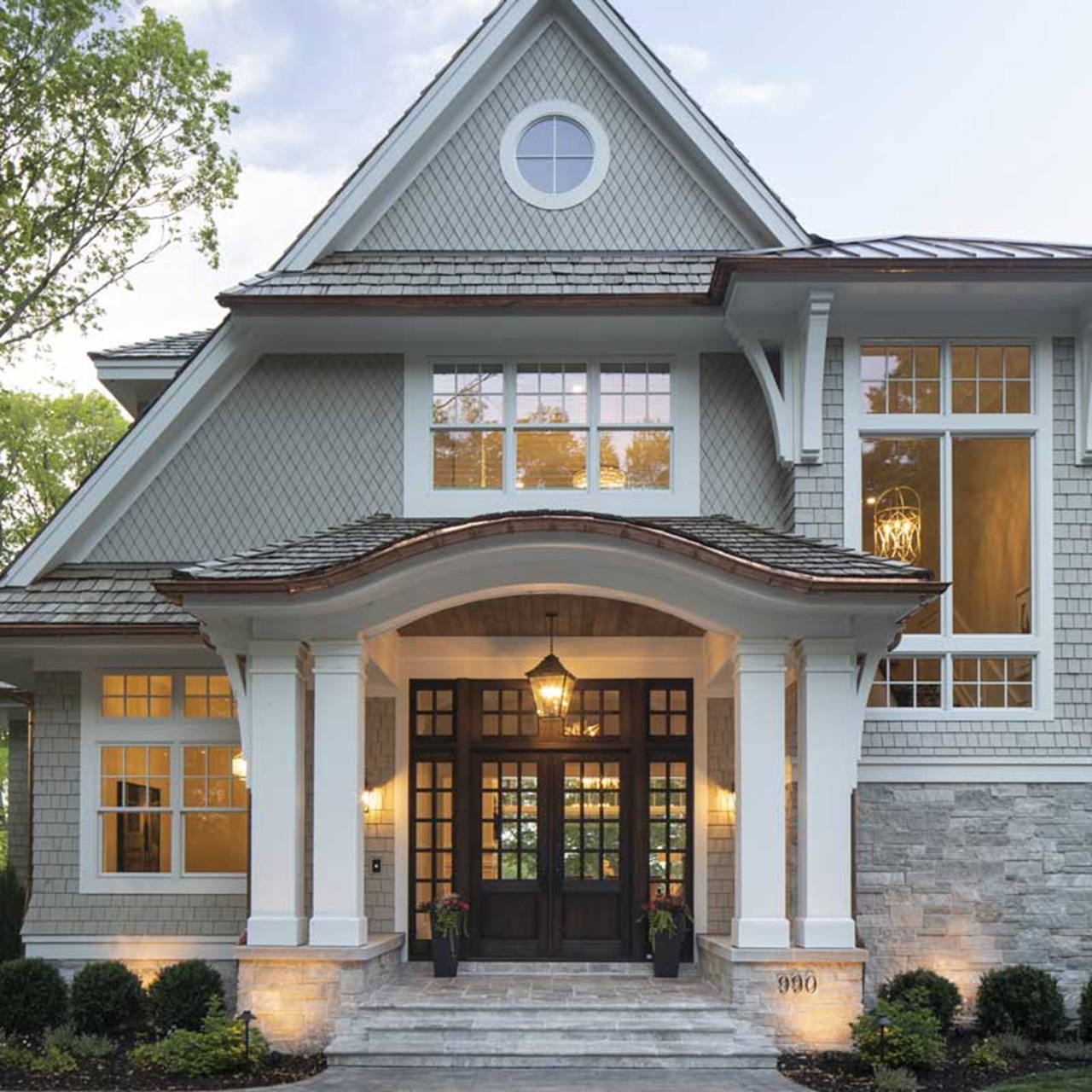 Front of cottage style home with white marvin elevate windows