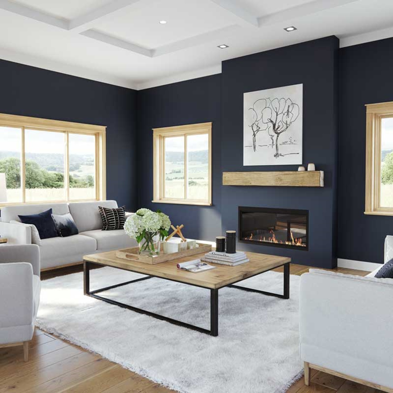 Living room with dark blue walls, seating and wood gliding windows