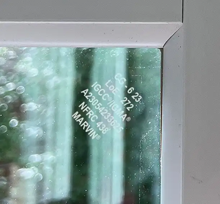 Close up of corner of Marvin Window with label on glass